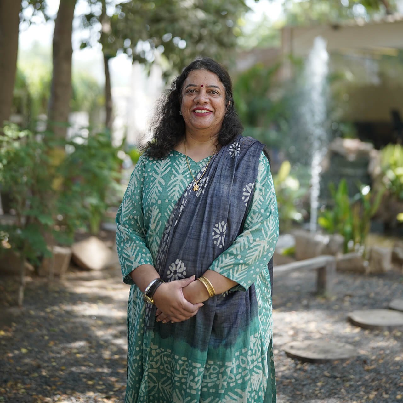 School Staff Member Portrait Standing Outdoors in Campus Garden Area