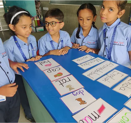 Schoolchildren Participating in Interactive English Word Matching Activity